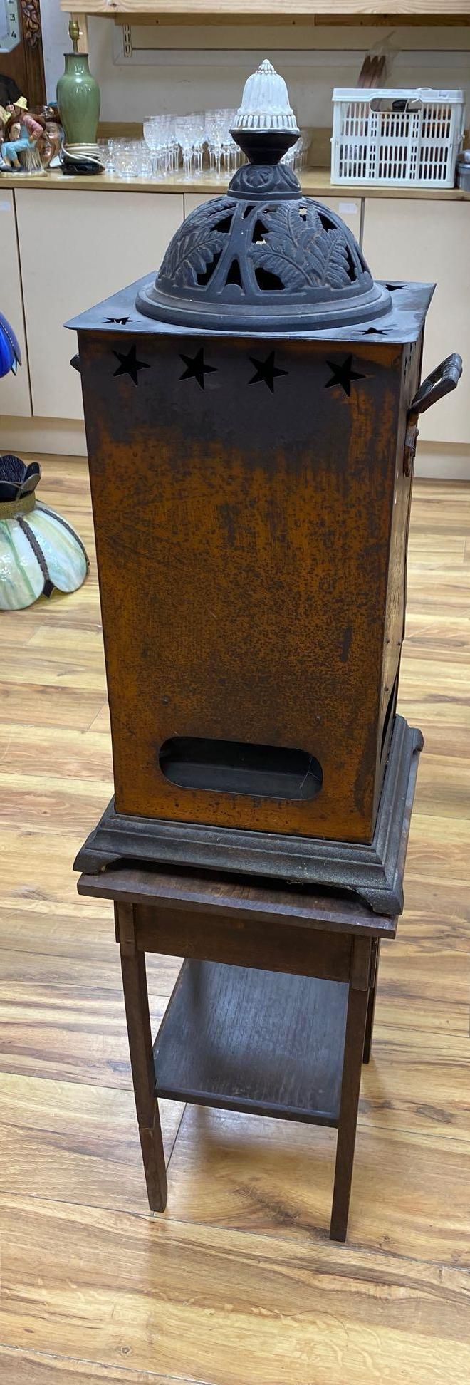 A Rippingilles Patent ABC Stove, Albion Lamp Co., oxidised copper frame, with leaded stained glass panel, circa 1860, 64cm high